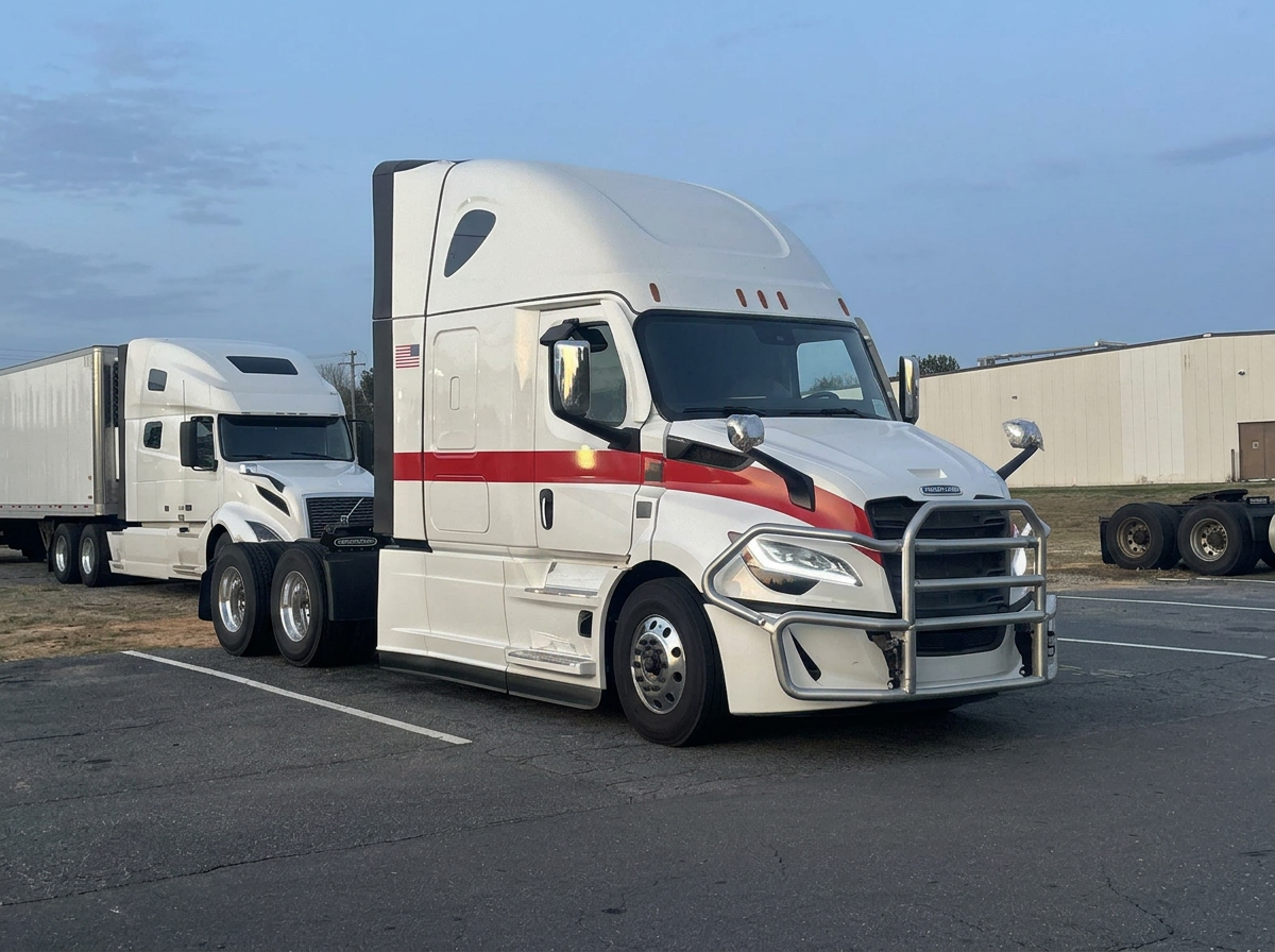 Clean commercial truck and trailer at a distribution center loading dock